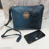 Croc-patterned shoulder bag for women, featuring a circular embellishment on strap, crafted from high-quality materials