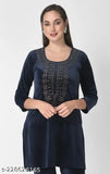 A woman in a navy blue fleece kurta with a V-neck and long sleeves