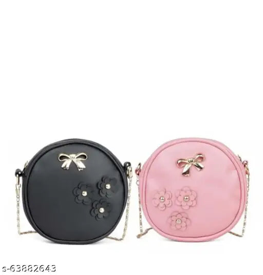 Black and pink sling bags with gold zipper details