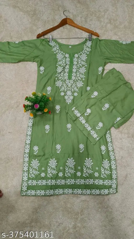 Premium rayon Chikankari kurta and palazzo set, embroidered net on traditional Indian attire