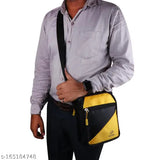 Black purse with yellow trim, crossbody design