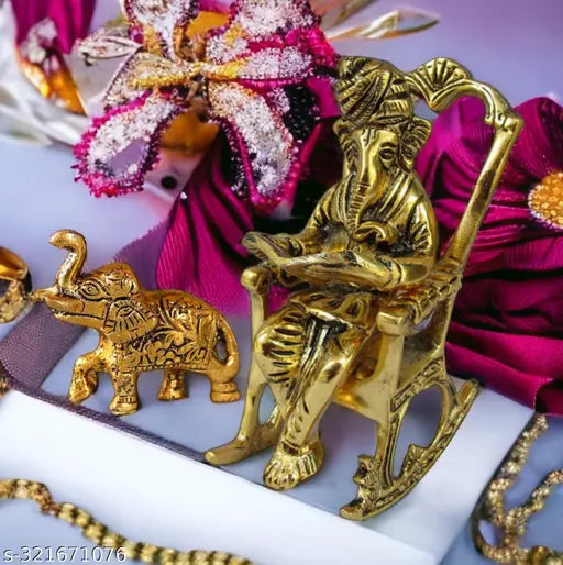 Artificial metal sculpture of Bhavya Art's God Ganpati reading Ramayana with Vedas, antique-style collectible, oxidized white finish, golden accents