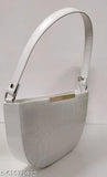 Silver metal purse with a single long strap and small slit pocket on the front