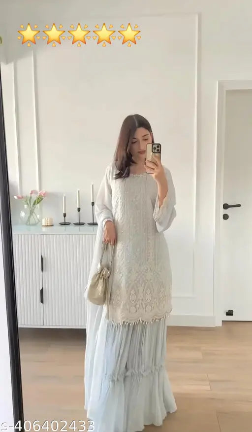 Cream lace tunic with long sleeves and ruffled hem