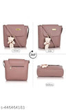 Stylish purple untextured leather handbag, zip closure, adorable teddy bear charm