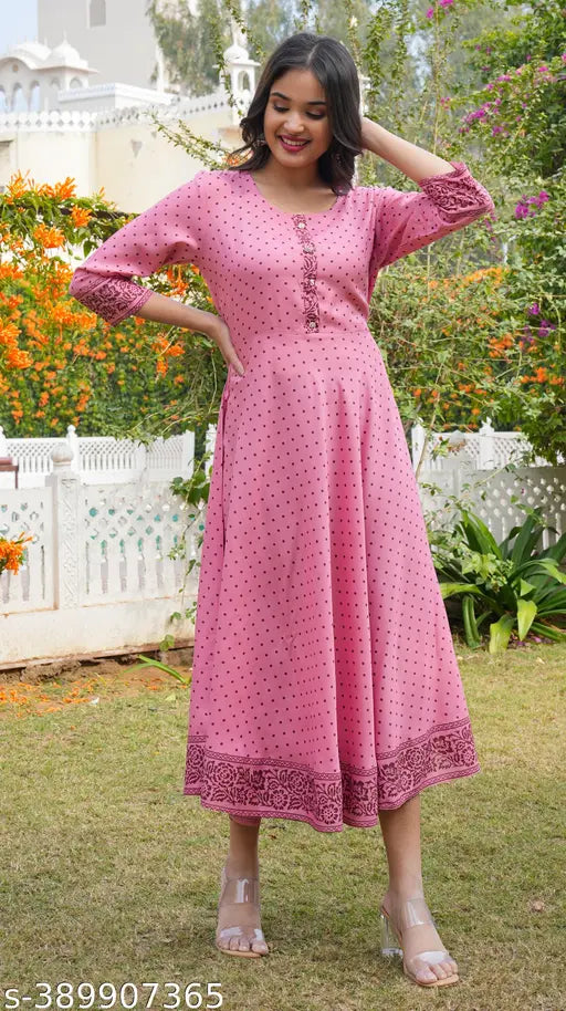 Women's rayon polka dot printed flared kurti with three-quarter sleeves, vibrant pattern on display, available in various sizes from S to XXXL