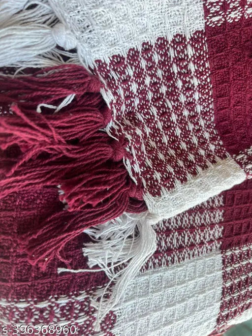 Red, white, and blue woven throw blanket with fringe ends