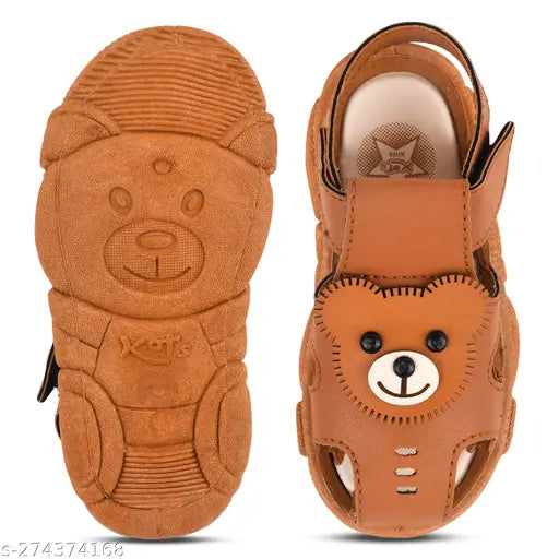 Brown suede sandals with cartoon character embellishment, teddy bear design