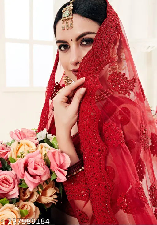 Embroidered semi-stitched lehenga choli set in net fabric, free size, Indian handcrafted embroidery on display