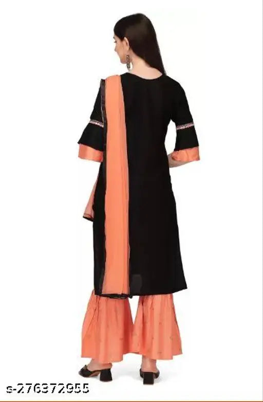 Orange long-length kurta set with flared hems, pair of black trousers