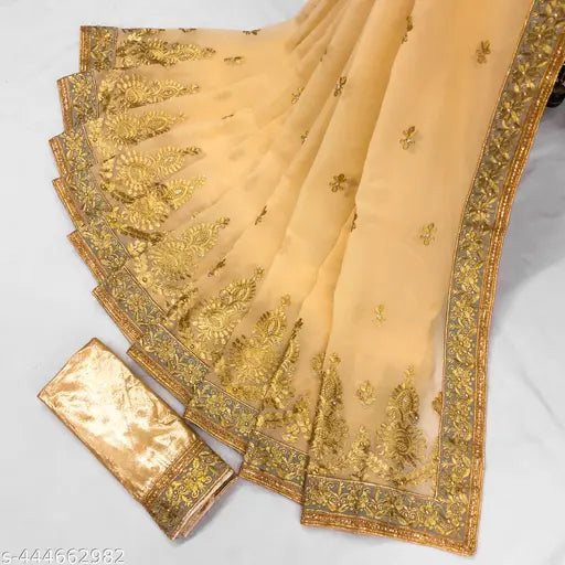 Tan, embroidered sari with beige pallu