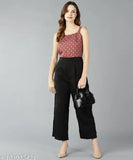 Women's white dot printed pink viscose rayon jumpsuit, sleeveless and sizes available XS-XL, patterned net on a model