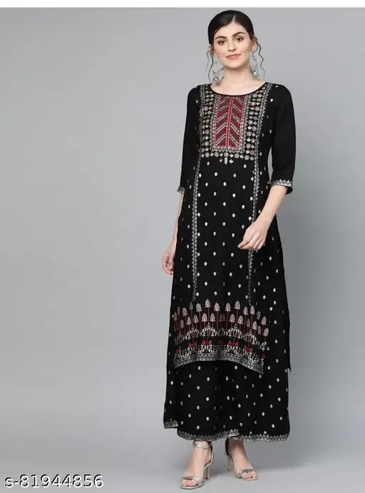 Black rayon kurta plazo set with embroidered net, three-quarter sleeves, and matching palazzos. Casual Indian attire for modern women