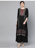 Black rayon kurta plazo set with embroidered net, three-quarter sleeves, and matching palazzos. Casual Indian attire for modern women