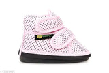 Pink polka dot baby shoes with casual design and foot support