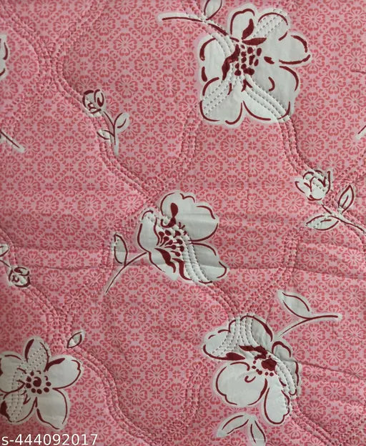 A pink flower pattern quilt, lightweight and breathable, reversible for two different looks