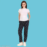 Trendy women's track pants with a navy blue print and white t-shirt