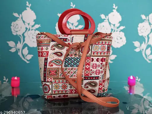 A printed handbag with an adjustable belt, featuring a variety of patterns and colors