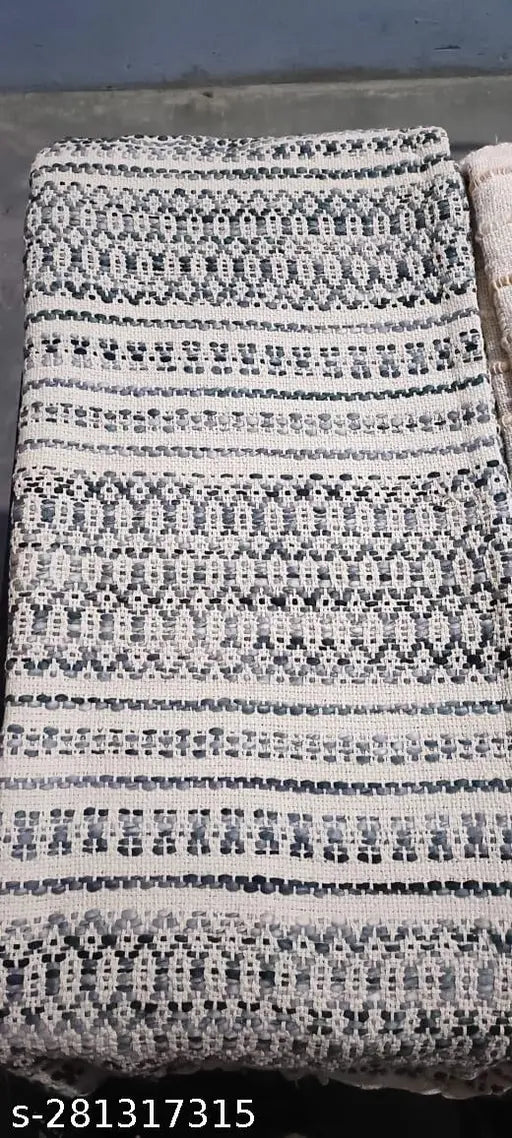 Handcrafted sofa throw with fringe and geometric pattern