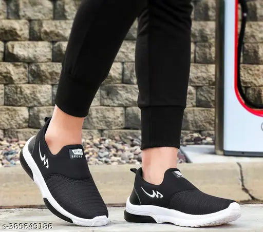 Black sports shoe with white laces and brand name