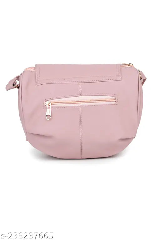 Pink leather sling bag with adjustable strap and two pockets