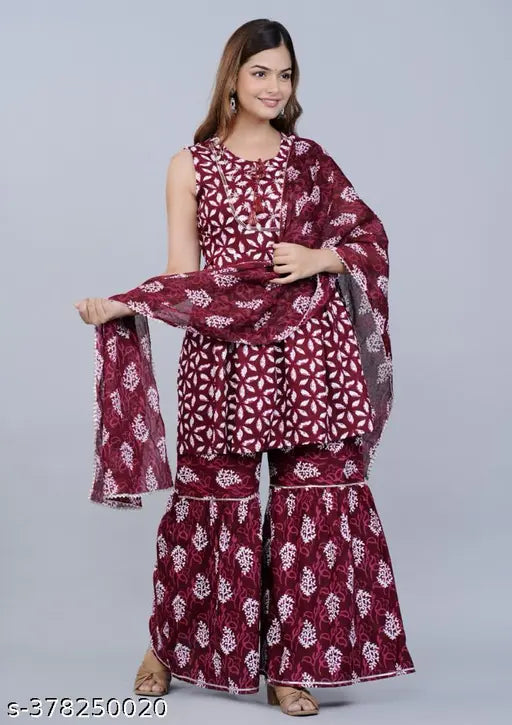 Maroon and white sari with flared bottoms