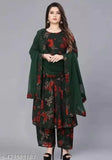 Woman in traditional green and red attire with floral embroidery