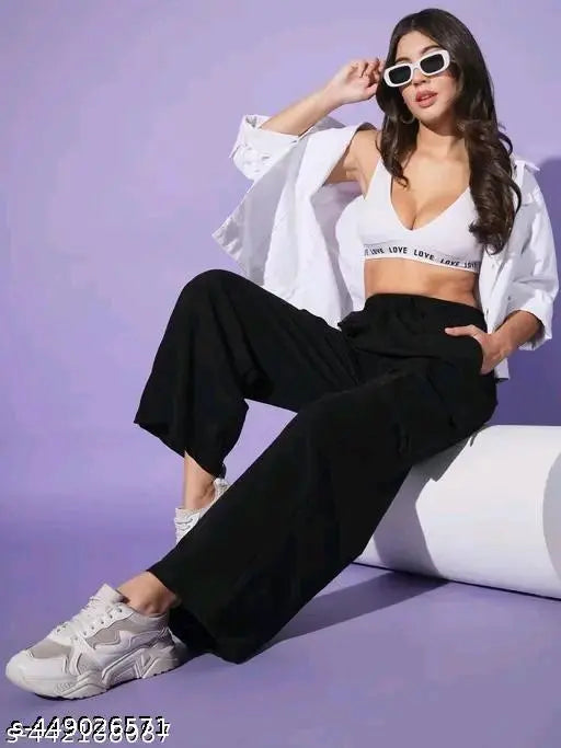 Black high-waisted women's cargo pants, with rolled-up legs