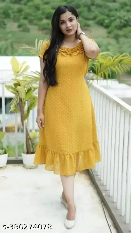 Yellow ankle-length kameez with flared sleeves, worn by a woman with black hair