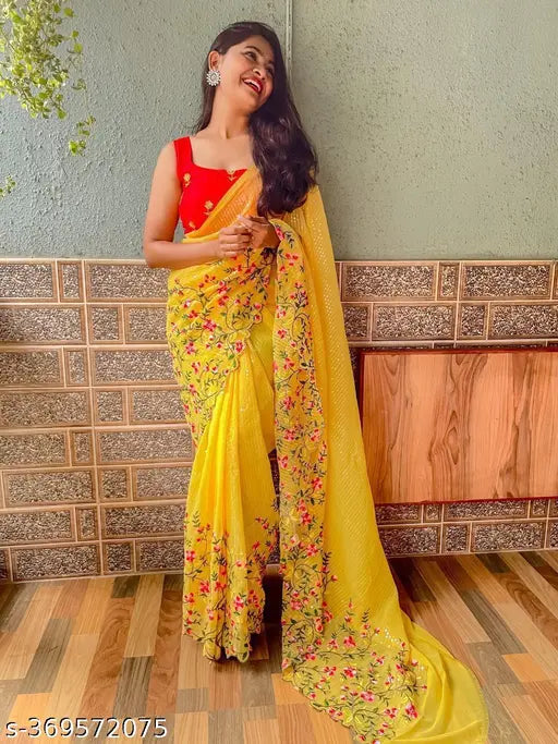 Yellow georgette silk saree with pink color embroidery work and red blouse, party wear