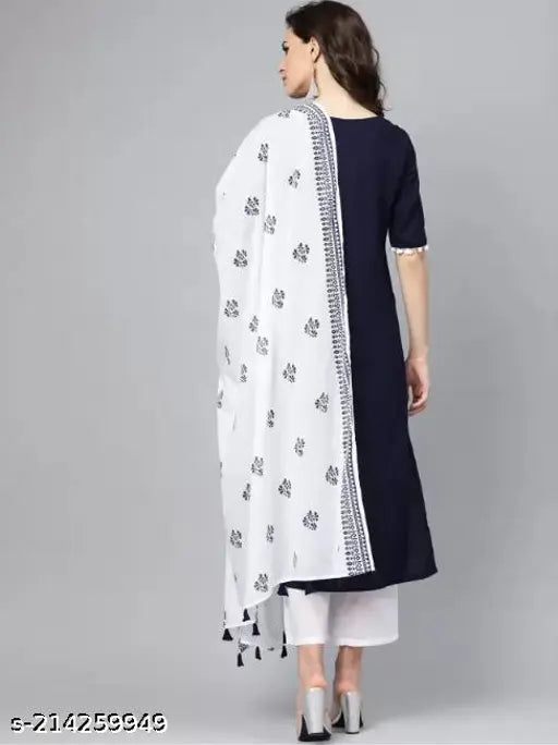 Navy blue rayon kurta with V-neck, short sleeves, and side slits paired with white rayon palazzo and cotton dupatta featuring tessels