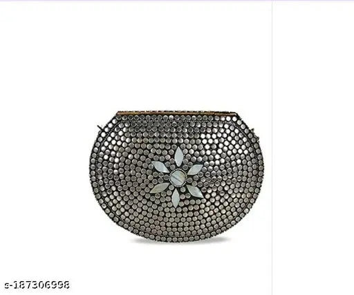 Silver filigree clutch with floral accents, metallic finish