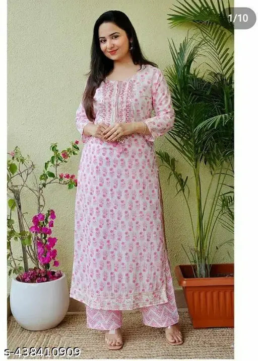 Pink rayon kurta with white pent bottomwear, printed net pattern, three-quarter sleeves, single size XXS-XXL, Indian ethnic wear on model with matching palazzos and accessories