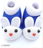 Blue baby booties with white trim and cartoon bunny