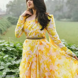 Yellow print Georgette gown, long sleeves, vibrant flower patterns. Indian-made celebration dress with stylish dupatta