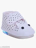 White baby shoes with blue star pattern, velcro closures