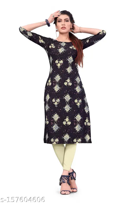 Woman wearing a black kameez with floral pattern, gold earrings, yellow leggings