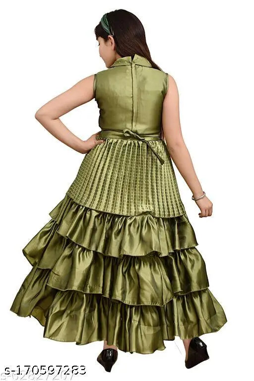 Green full-length party dress with long ruffled sleeves and cinched waist, perfect for girls' party wear. Ethnic gowns in trending solid silk blend for a formal or festive event. Kids wear best quality girls frock
