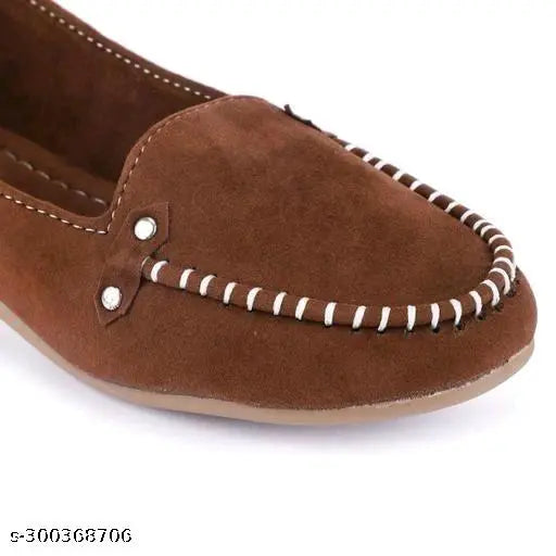 Brown suede loafer shoe with white stitching and button details.