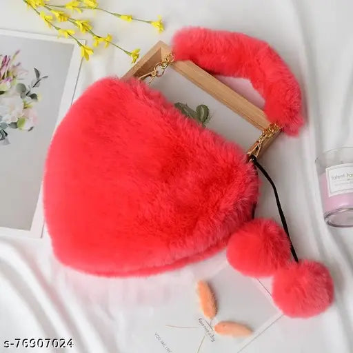 Red faux fur handbag with a heart shape and metal chain strap