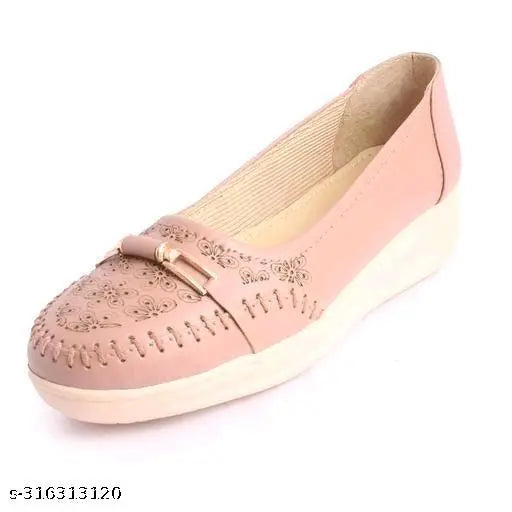 Pink leather ballerina shoes with a floral design and elastic strap.