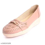 Pink leather ballerina shoes with a floral design and elastic strap.