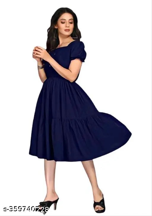 Navy Blue Rayon Fashionable Flared Kurti for Women - Solid-colored, flattering fit and flare design, perfect for casual events or office wear, sunshine yellow print accentuates natural curves. Made in India