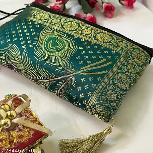 A handcrafted blue and gold wallet, possibly velvet, with multiple card slots