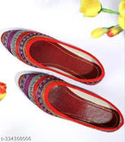 Embellished synthetic leather red bindi BL, traditional Indian accessory on a stand