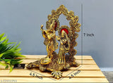 Golden aluminum oxidized Radha Krishna idol with diya, 11.5 cm (L) x 18 cm (H) x 11 cm (W), Indian God showpiece featuring Lord Krishna playing flute and standing with Radha, ideal for gifting on any occasion