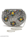 Silver metallic handbag with colorful embroidery, round studs