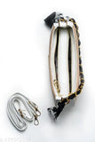 Stylish black and white patterned sling bag, gold chain strap