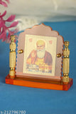 Orange-tinted glass Guru Nanak idol with metallic pillars, decorative item for home, office, or car