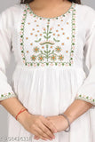White embroidery top with floral pattern and open neckline, long sleeves